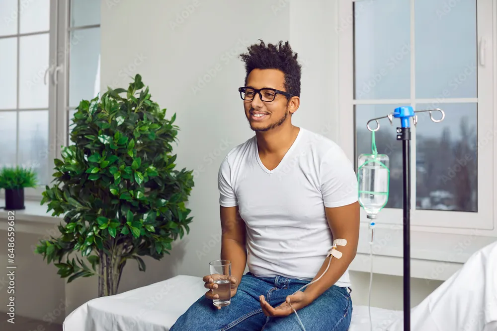 Male patient receiving IV hydration in a modern wellness clinic